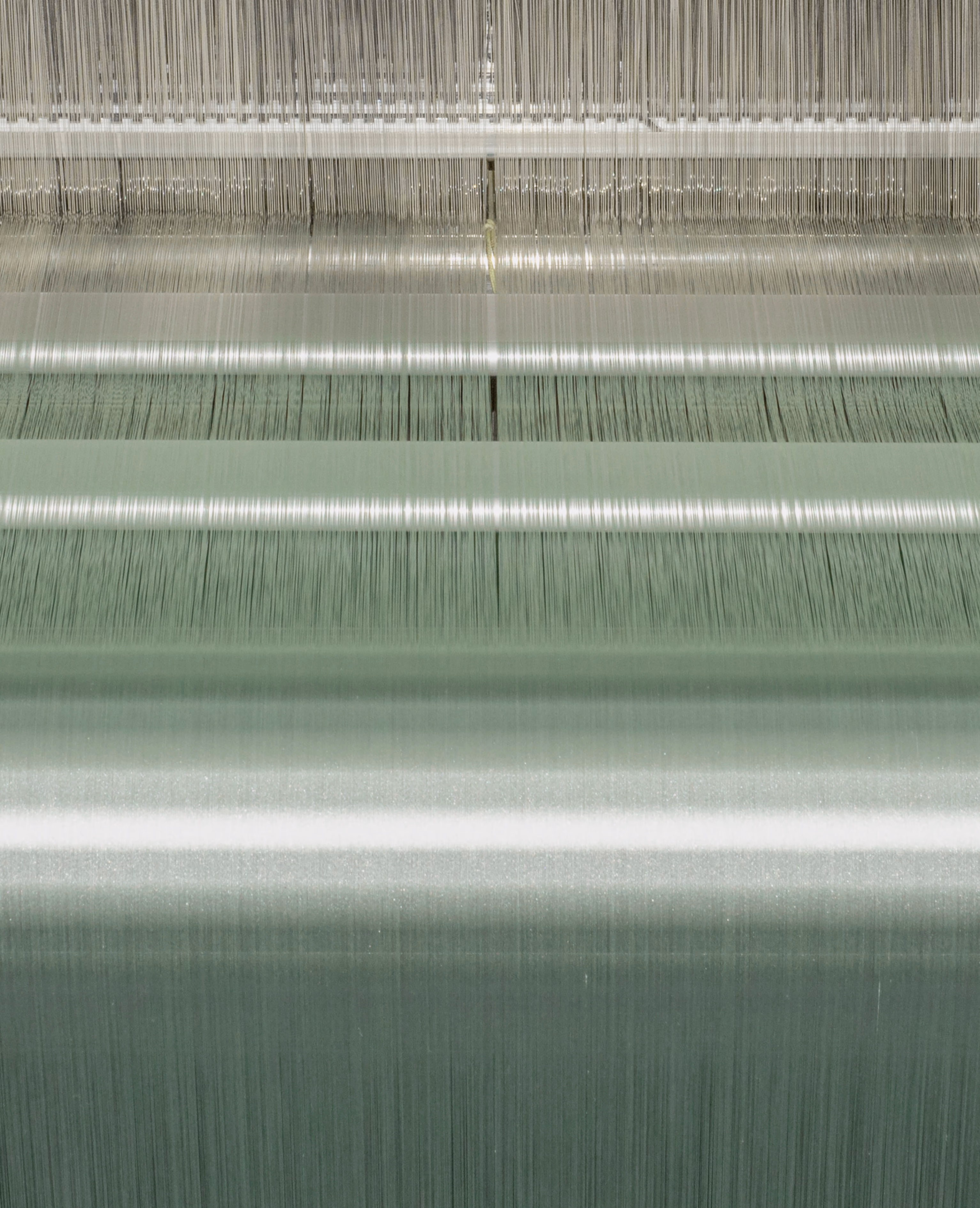 Warp threads on the back of the weaving loom