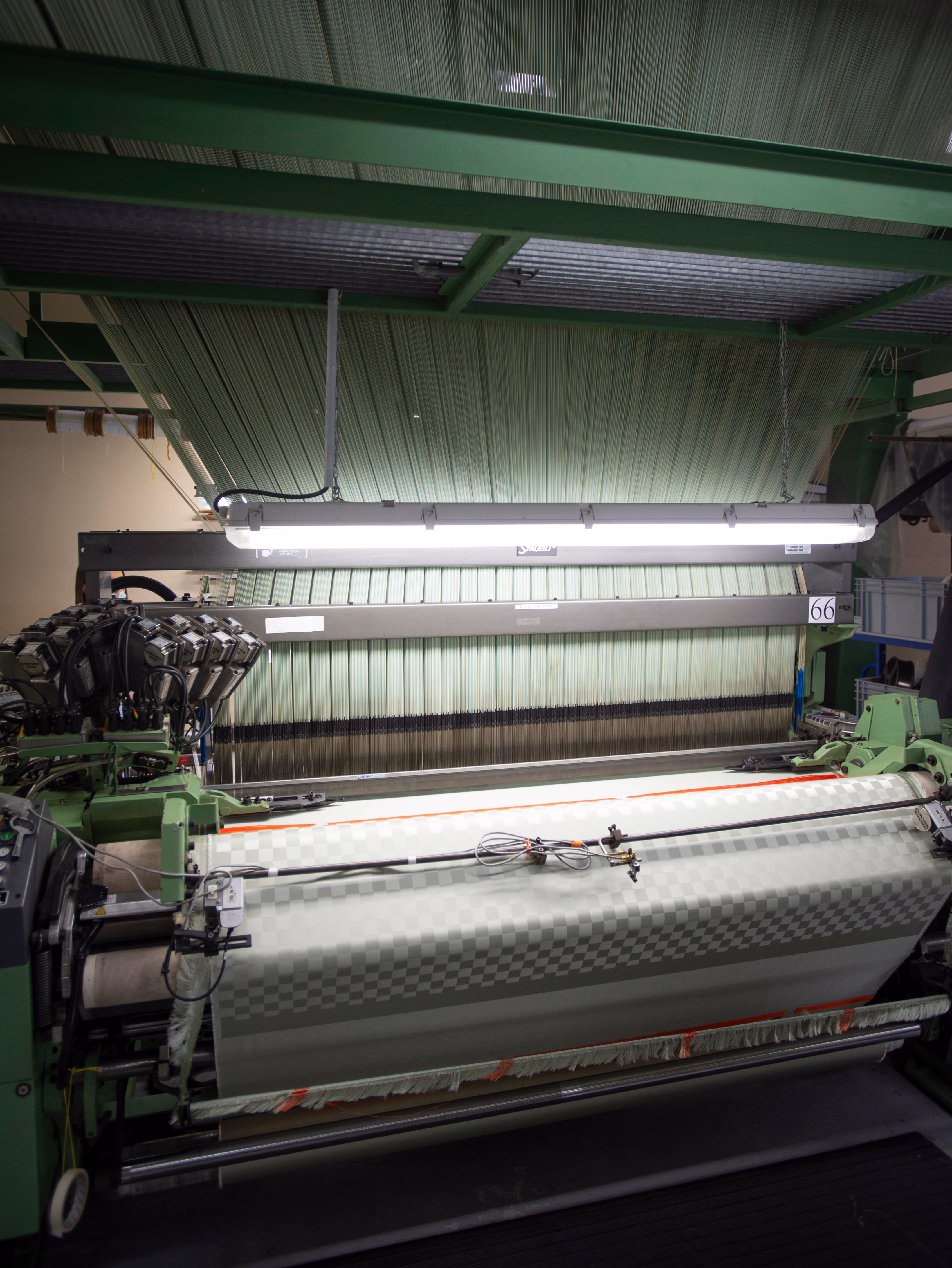 On the loom, 162 cm wide, 18,424 warp threads across the width