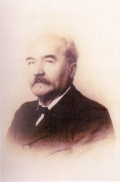 Portrait photographique sépia de Balthazar Eugène Prelle, homme moustachu en costume